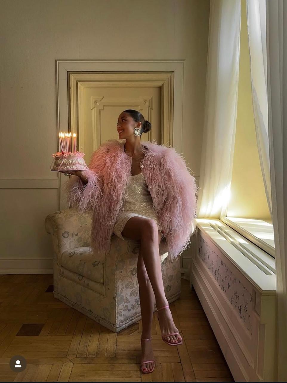 Pink feather coat birthday moment